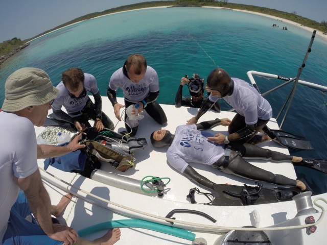 Freediving competition safety and medical team running rescue simulations.