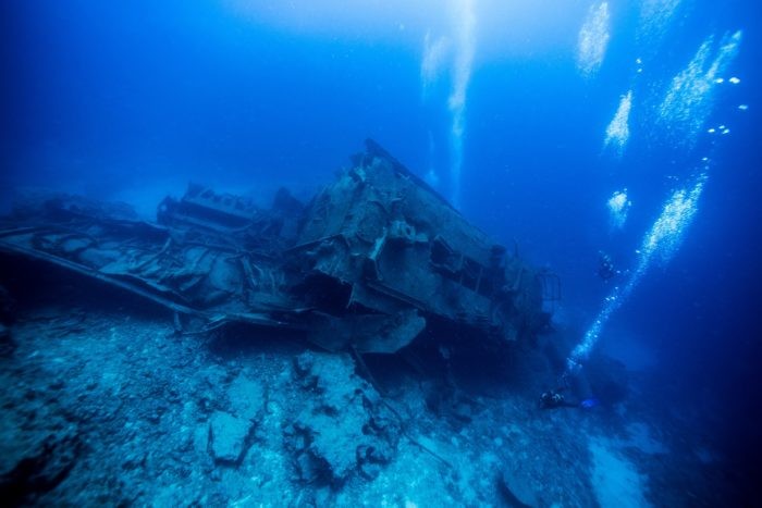 Scuba Divers On A Shipwreck