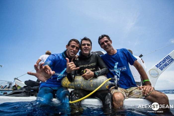 Alejandro Andres, pumped after his national record dive, flanked by Damian Scalfaro and Esteban Darhanpe.