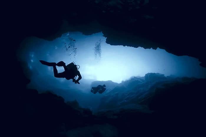 Technical Diving - Scuba Divers exploring a cave system in Mexico