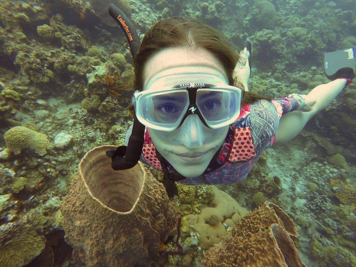 sofia on the reef near a sponge barrel