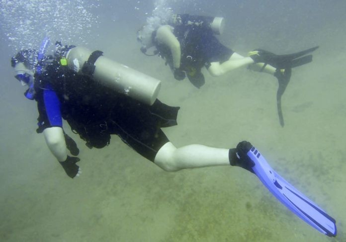 Charles James Shaffer swims through the water during his first certification dive as part of the Soldiers Undertaking Disabled Scuba (SUDS) program, US Army Photo