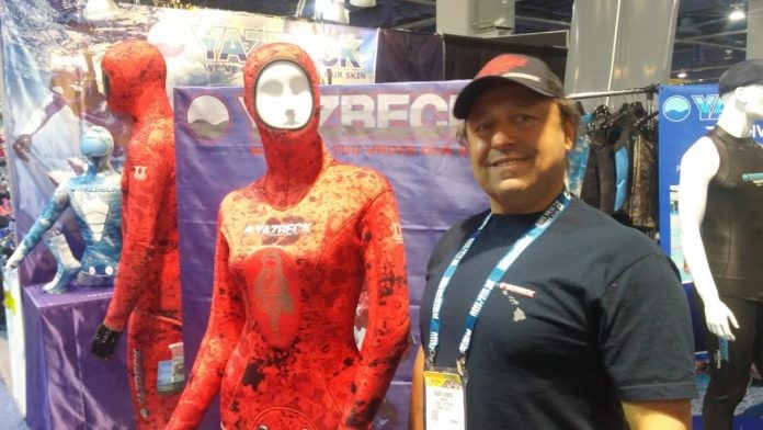 Roger Yazbeck stands proudly next to his women's version of the new Nohu Wetsuit
