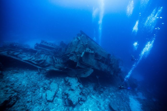 Scuba Divers on a Wreck