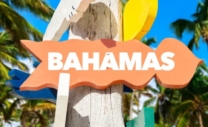 Bahamas signpost with palm trees