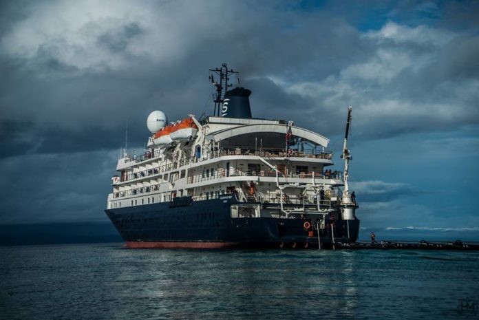 Cruise Ship MV Caledonian Sky Runs Aground Onto Raja Ampat Reef (photo credit: Hugo Mattson)