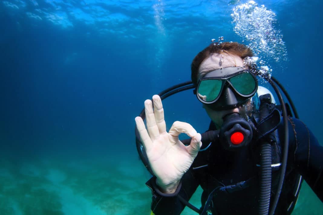 Scuba diver showing an OK hand signal