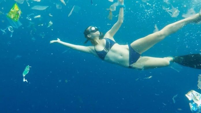 Free-diver Julia Wheeler swims through three tonnes of rubbish in Bali