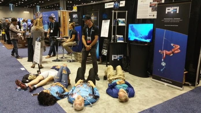PFI Staff Instructor, Ryan Reed, helps show goers achieve a 3-minute breath hold