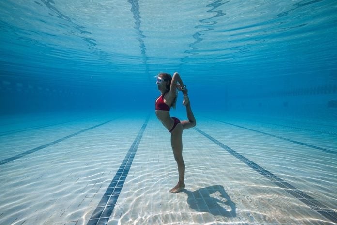 Kate Middleton striking a yoga pose in the pool