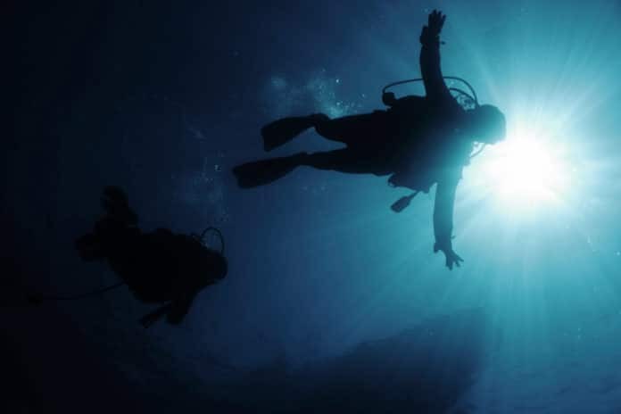 Divers in back-light