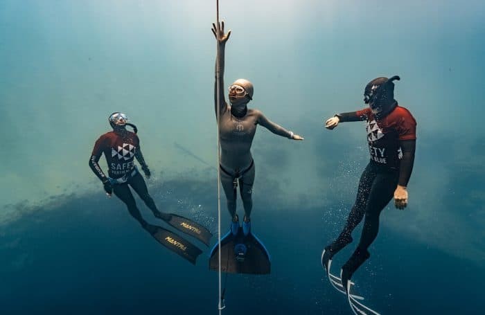 Safety divers providing safety for an athlete at a freediving competition. Photo by Daan Verhoeven.