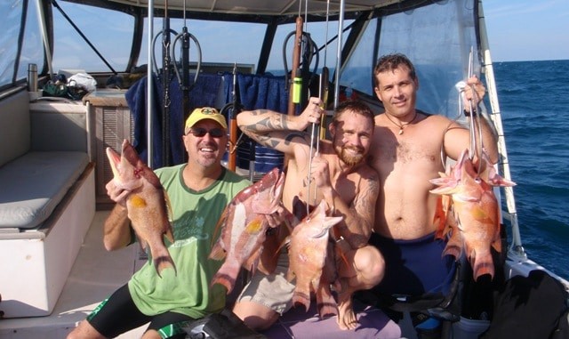 Happy customers after a spearfishing expedition