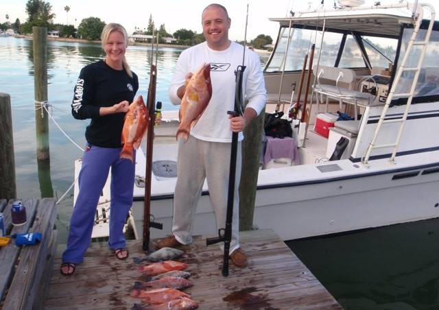 Happy customers after a spearfishing expedition