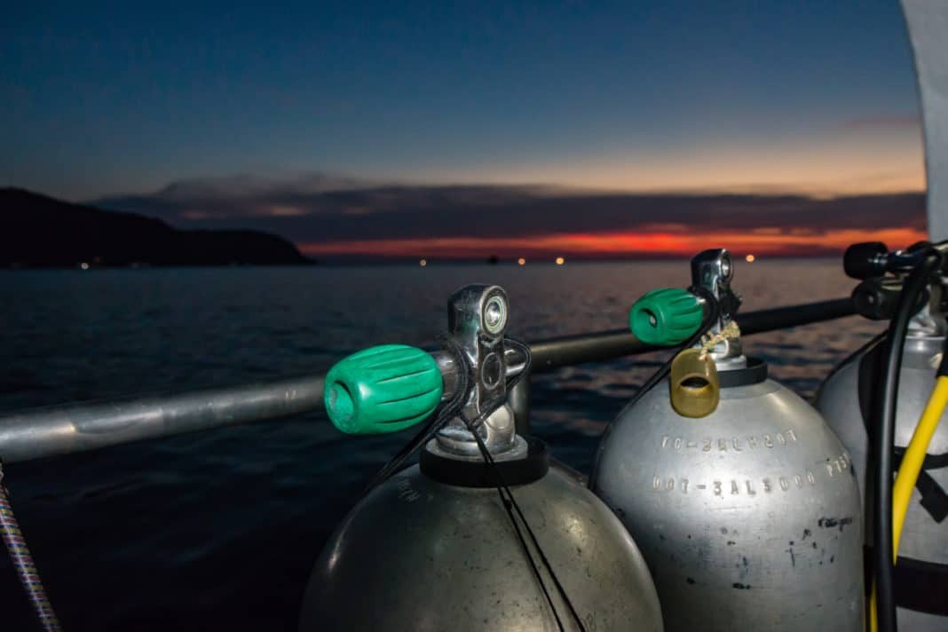 SCUBA tanks on a dive boat prior to a night dive