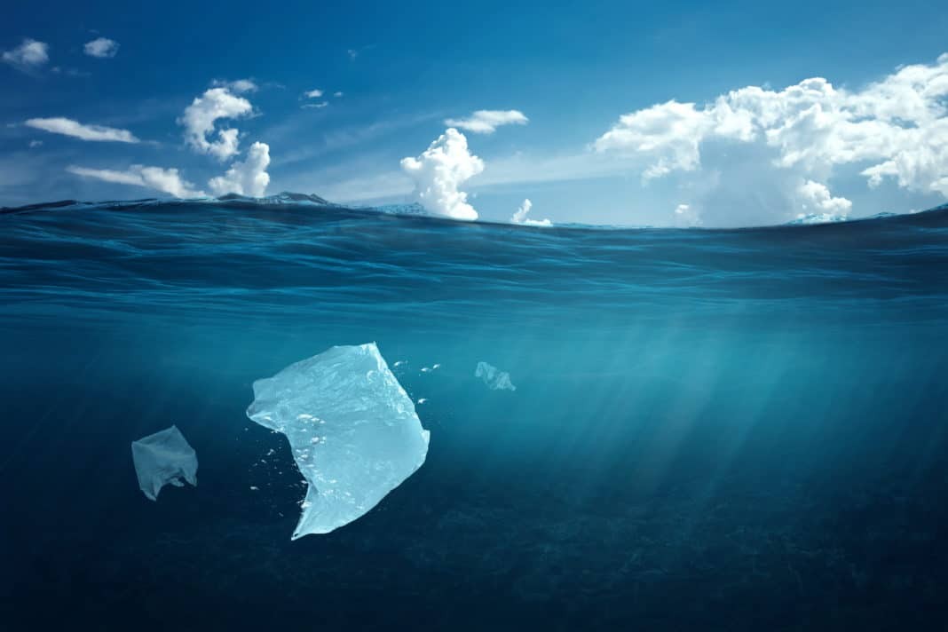 Plastic bag floating in the ocean, a bag in the water. The concept of environmental pollution, non-decomposable plastic, increased debris in the world's oceans.