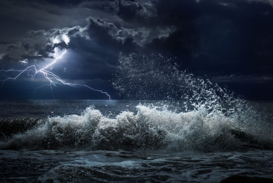 Dark ocean storm with lgihting and waves (Adobe Stock photo)