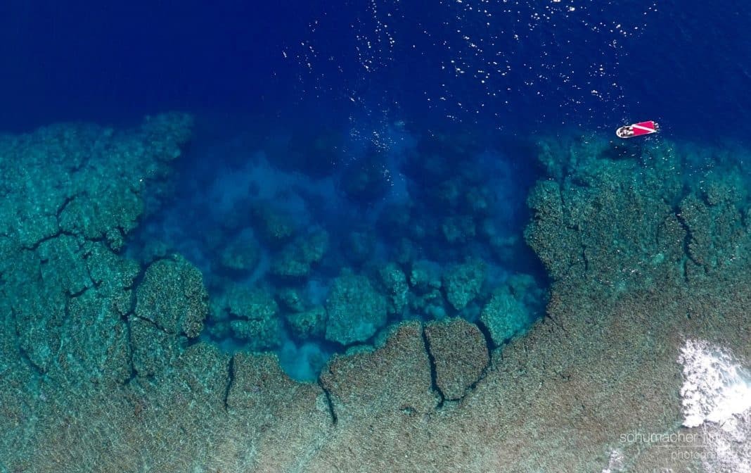 With barely 1,000 divers a year the dive sites on Yap are for you and your buddies. Arial shot of Yap Caverns. One of Yap's signature dive sites. - Picture by Andy Schumacher