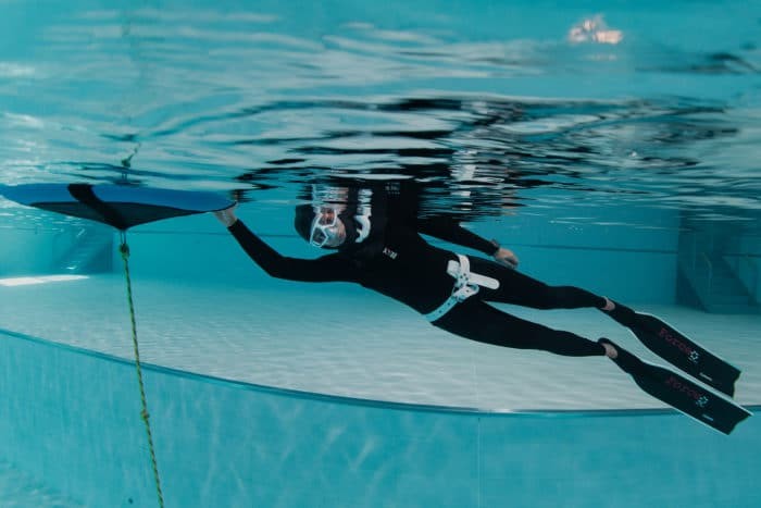 Preparing for a dive in the Fourth Element RF1 Freediving wetsuit