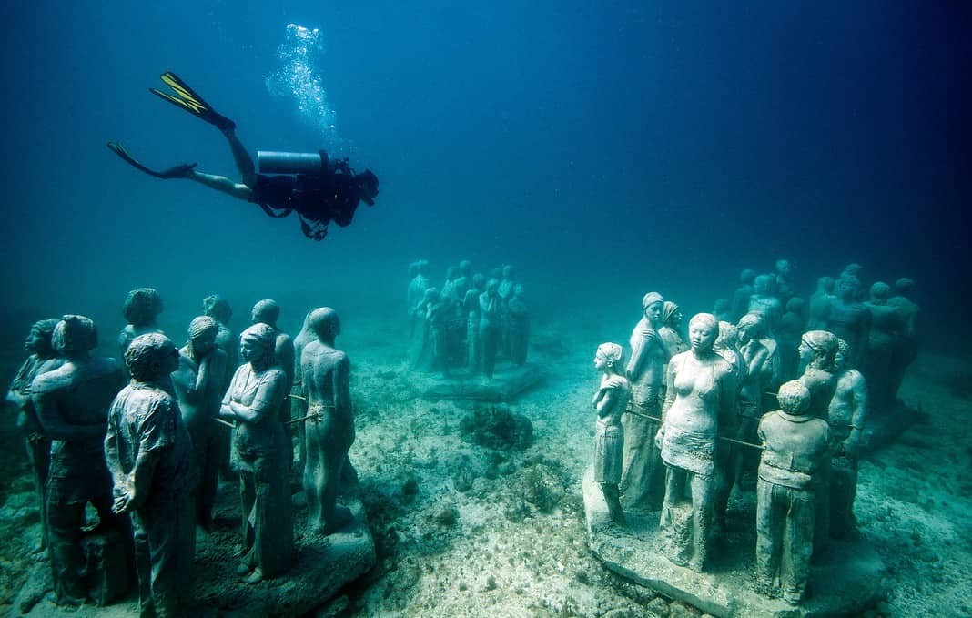 Jason DeCaires Underwater Museum is one of the best dive sites when Scuba Diving Cancun