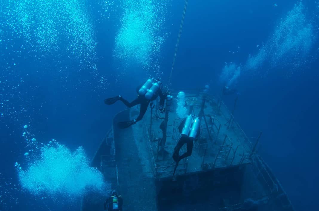 Scuba divers descending on the Vanderberg - Scuba Diving Key West