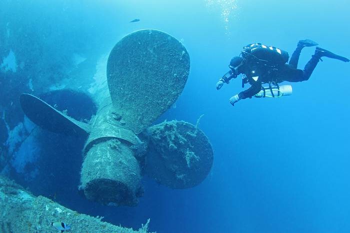 Scuba Diver explore the the Zenobia, one of the best wreck dives in the world