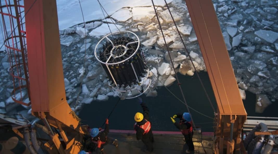 Collecting measurements in the ice, the western Arctic Ocean (Image credit: Peigen Lin/©Woods Hole Oceanographic Institution)